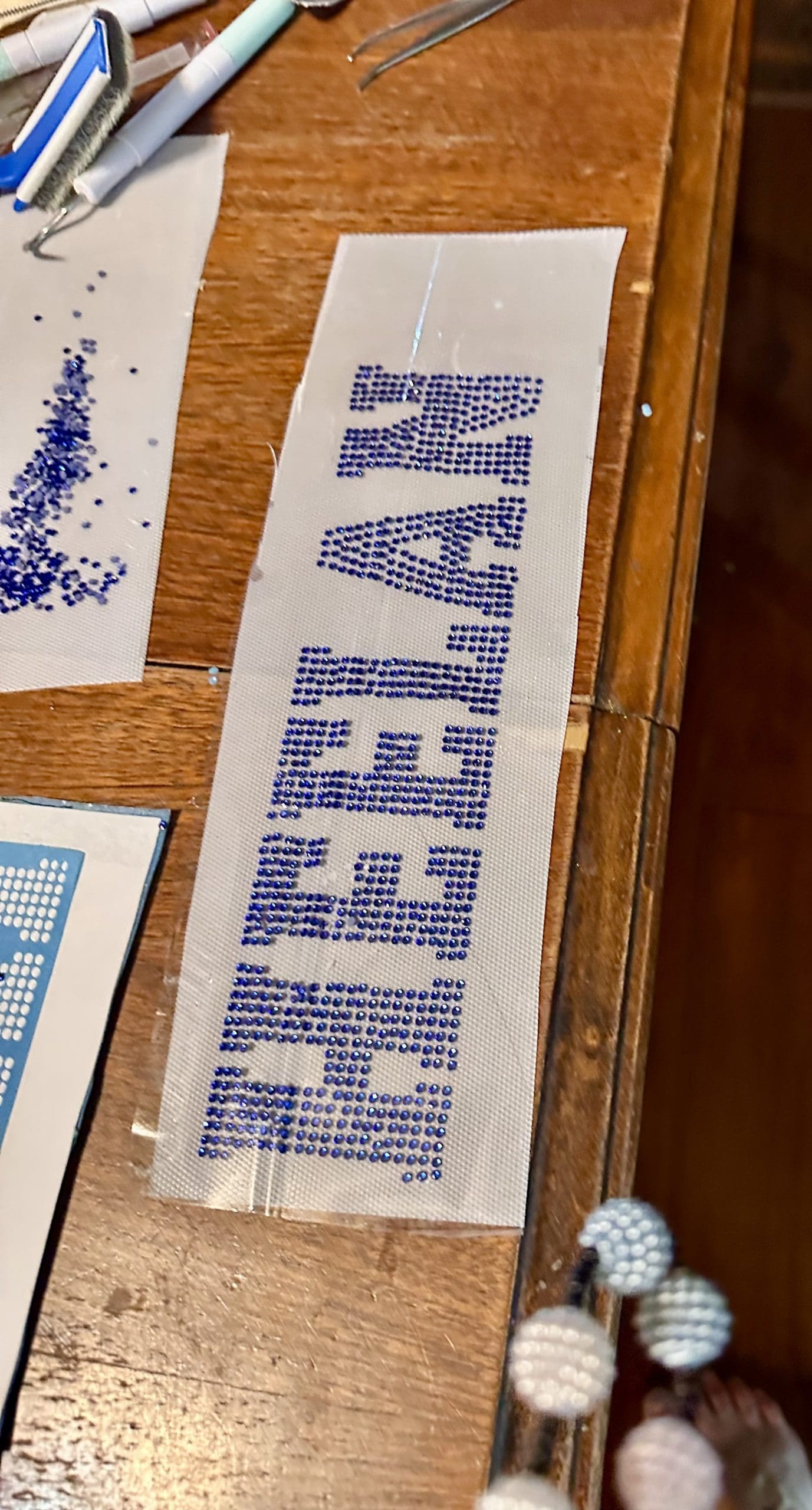 rhinestone lettering for branding heelan highschool dance team