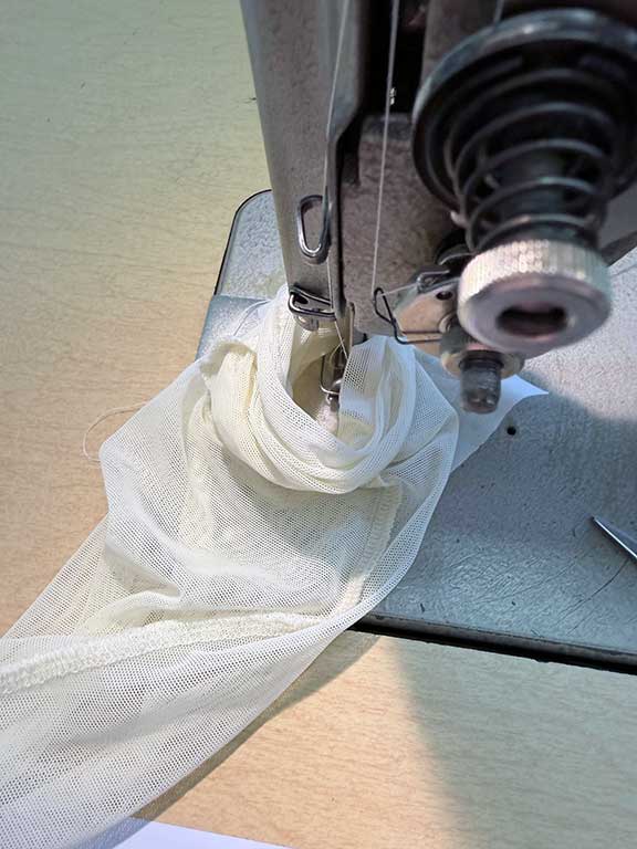 sewing machine, alteration on a custom competitive costume that needed mend due to hole prior to worlds