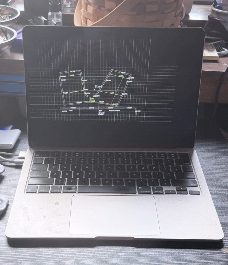 Computer with drafted pattern to be projected on to material future innovation and visionCONSTRUCTING THE PAPER FOR THE DESIGN PLANNING STEP 2