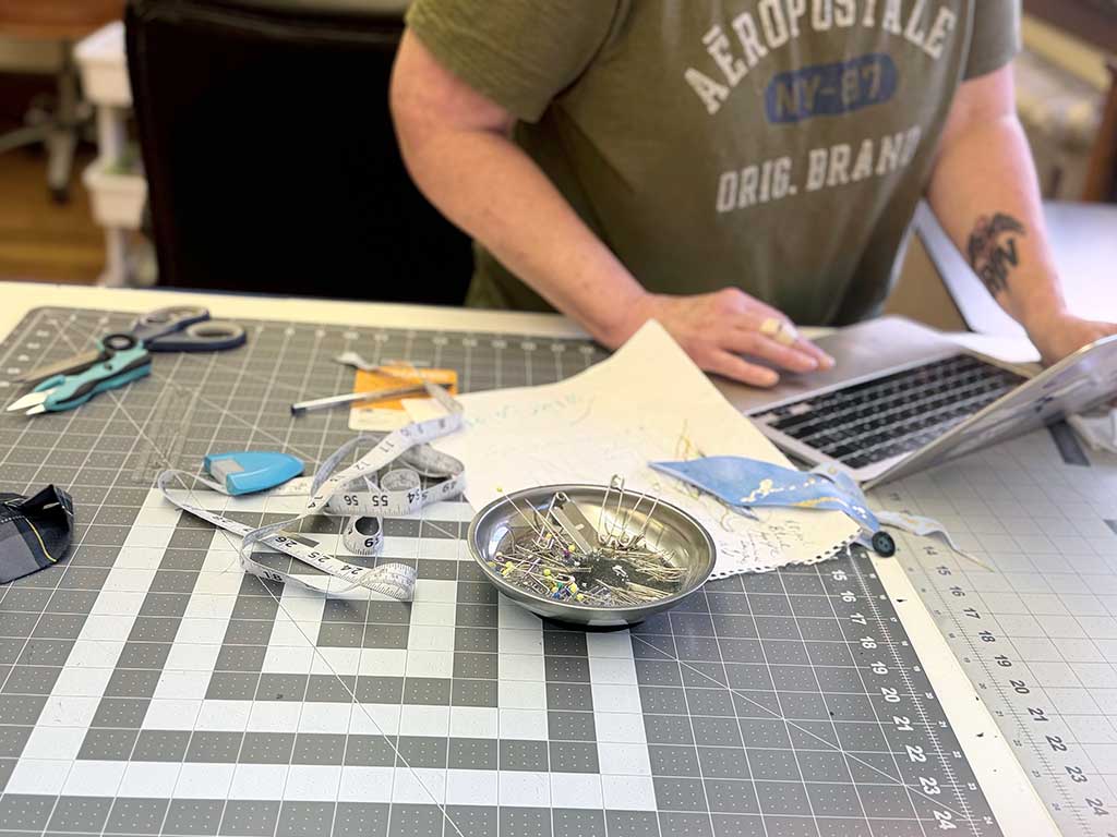 Sewn 2 Dance founder, Charmaine Regino working on Concept Direction for a custom design service solo dancewear outfit