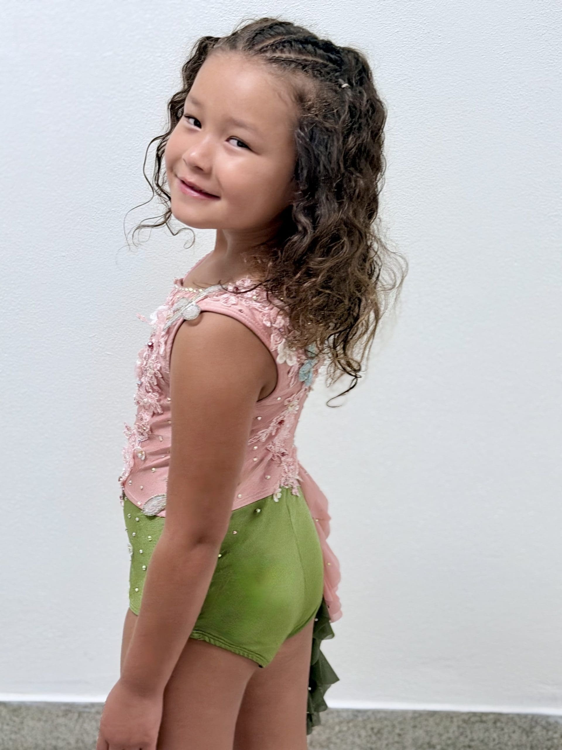 girl in pink and green custom lyrical costume by sewn 2 dance design consultation