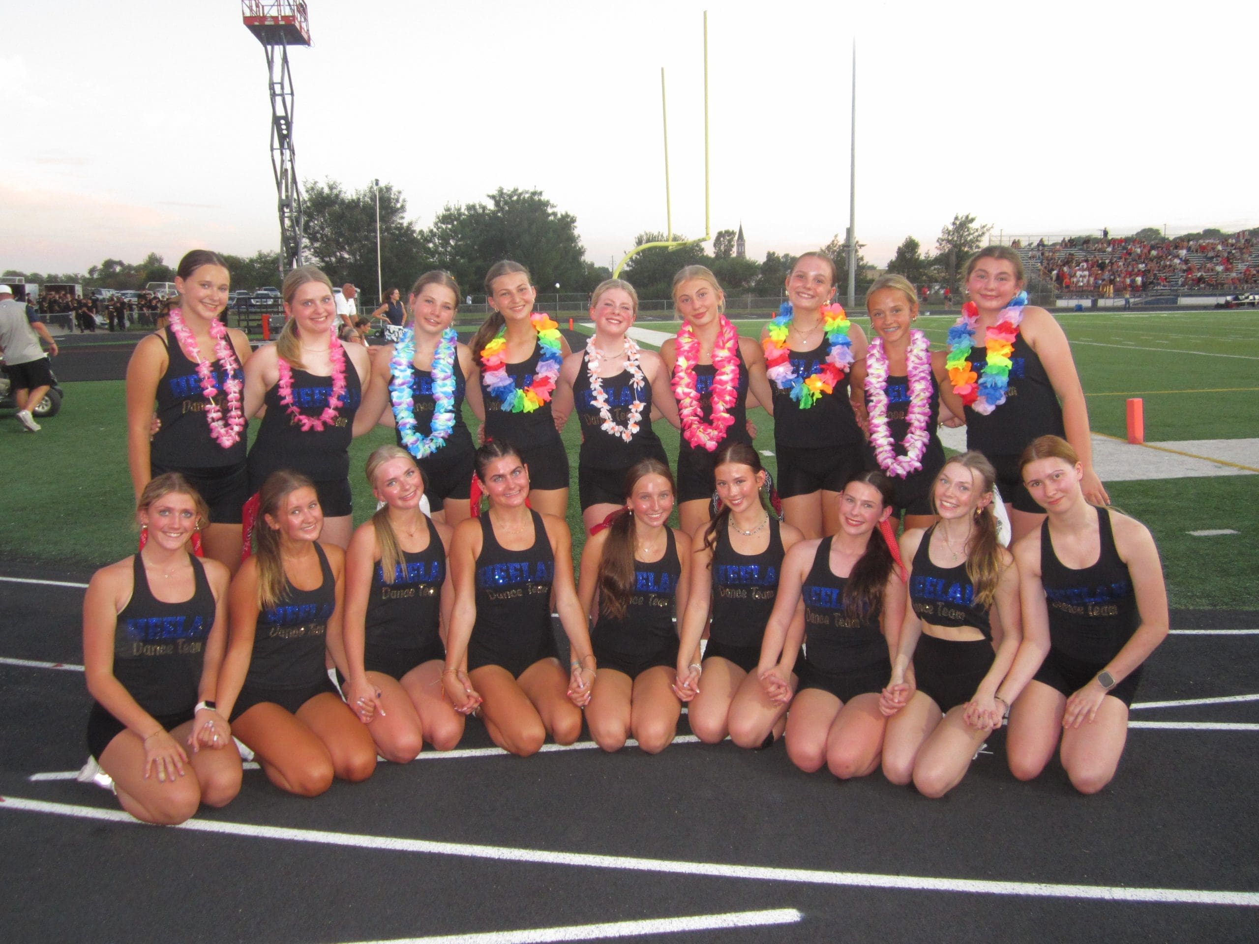HEELAN DANCE TEAM AT FOOTBALL GAME IN TEAM BRANDING BY SEWN 2 DANCE